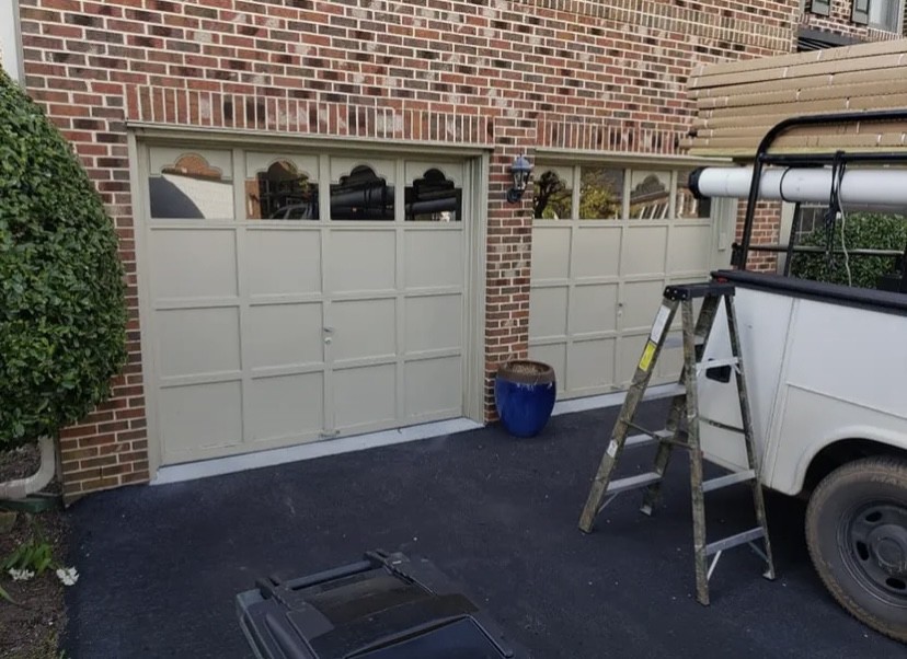 double Garage Door Maintenance with ladder and back of truck